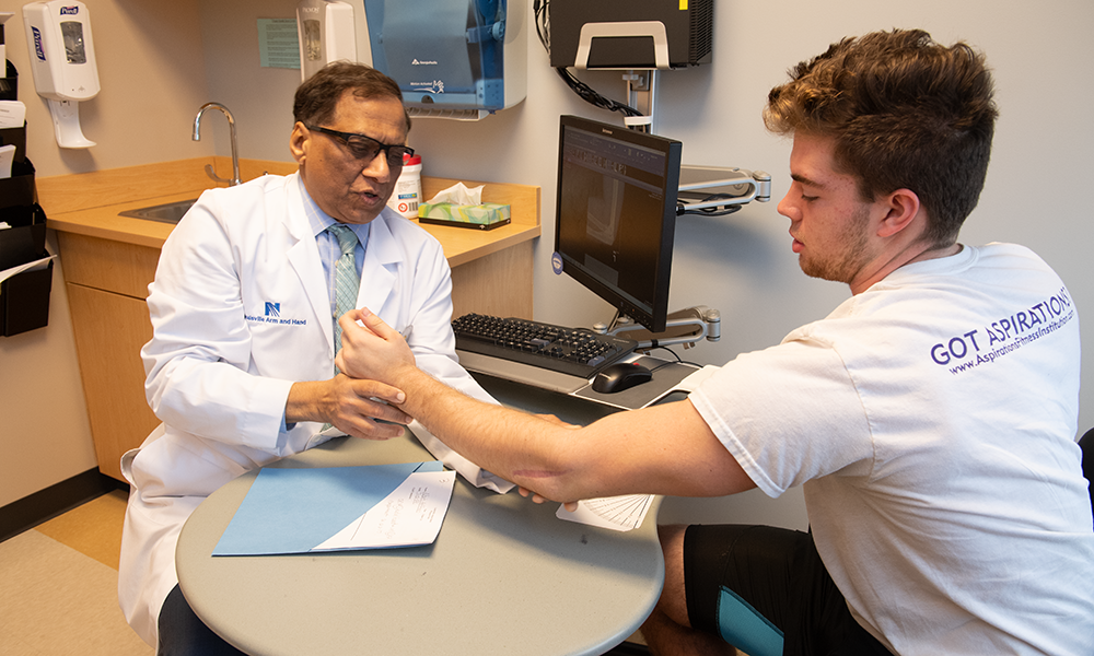 A provider with Norton Arm & Hand Institute is pictured, demonstrating the type of personalized care patients can expect.